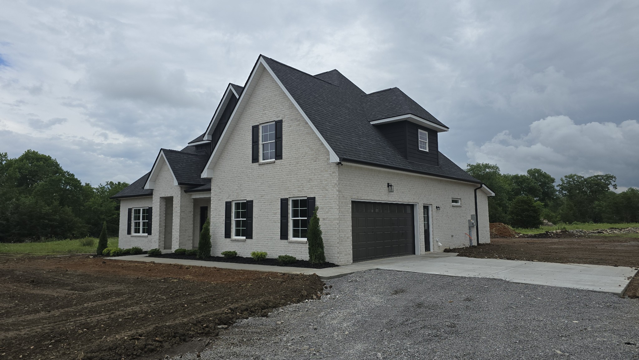11533 Karo Road Bell Buckle, TN 37020 - Photo 2 of 22 a front view of a house with a yard