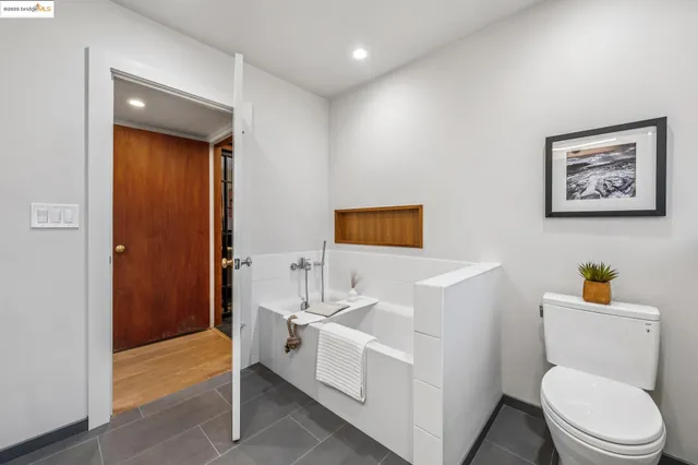 a bathroom with a double vanity sink mirror and shower