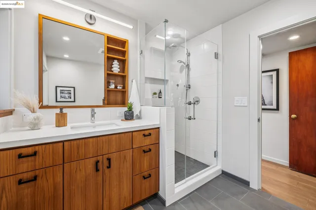 a spacious bedroom with a large bed and a large window