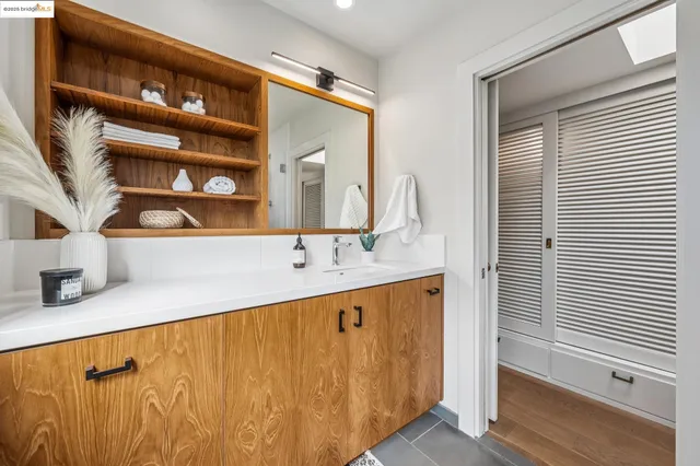 a white toilet sitting next to a bathroom sink