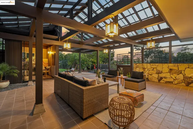 a view of a backyard with sitting area