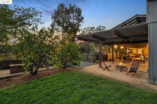 a view of a patio with chairs and a table
