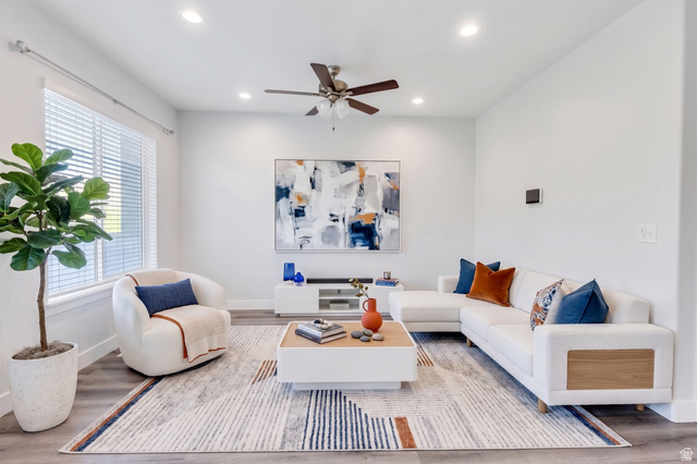 16422 Bull Spring Road, Unit 920 Riverton, UT 84065 - Photo 7 of 42 Recessed ceiling lighting, a ceiling fan fixture, large windows, and wood-finish flooring