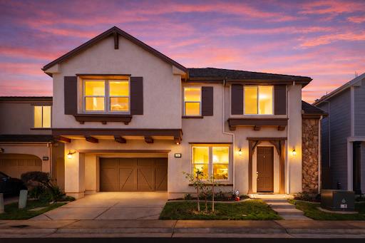 a front view of a house with a yard