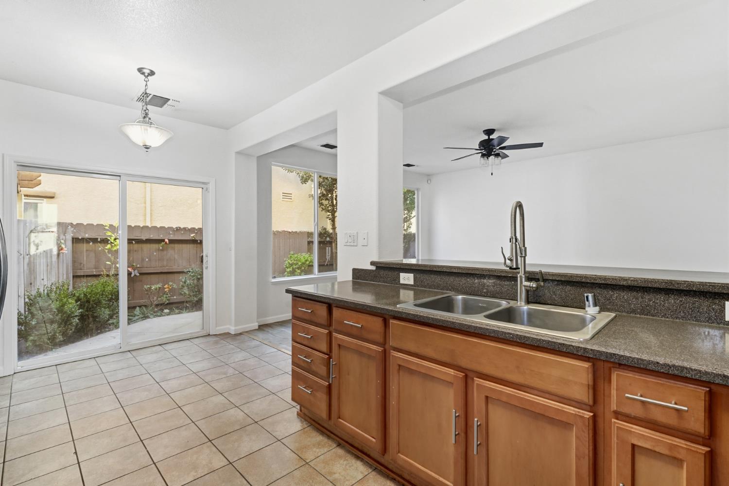 11832 Stoney Ridge Way Rancho Cordova, CA 95742 - Photo 12 of 44 a kitchen with a sink and a large window