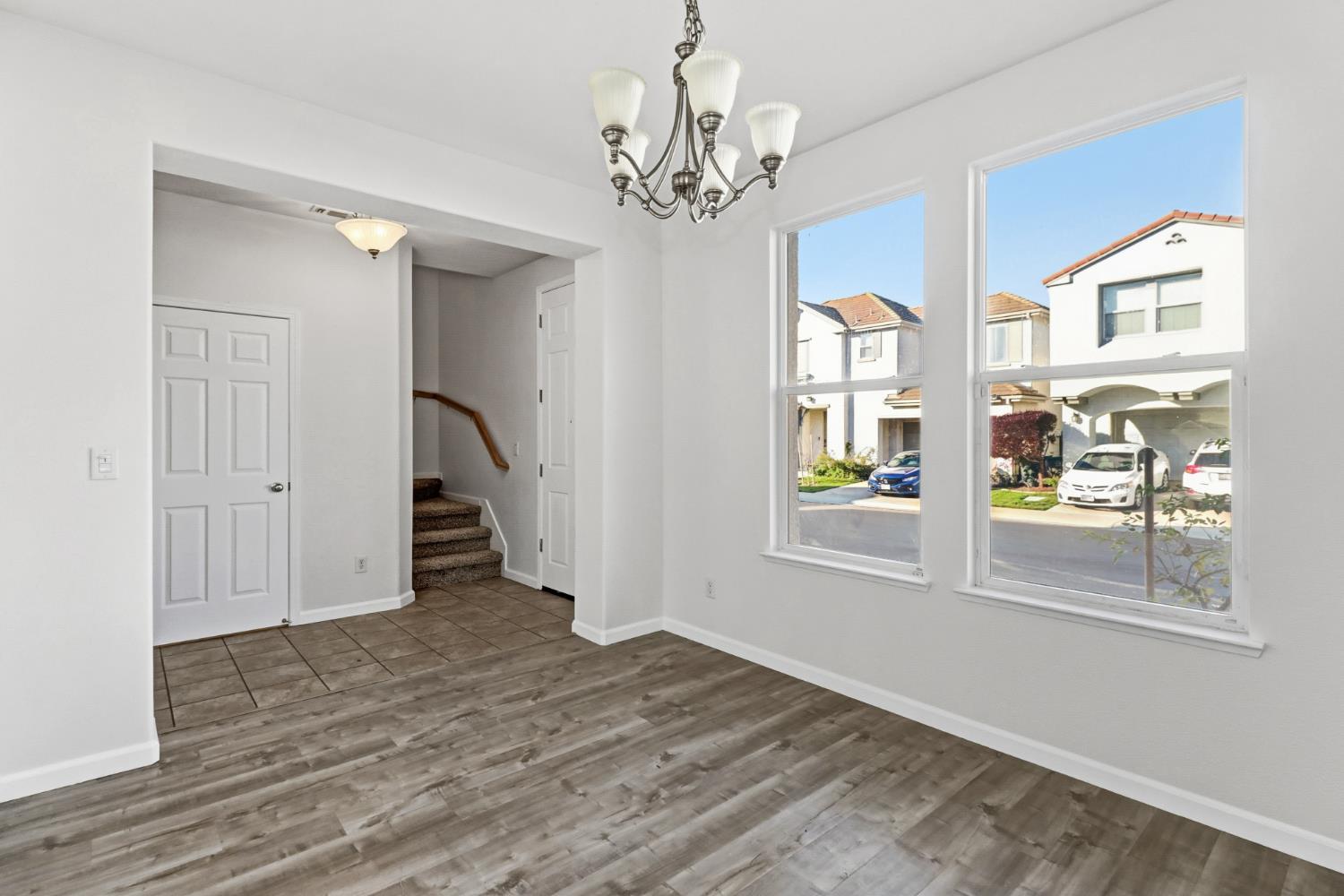 11832 Stoney Ridge Way Rancho Cordova, CA 95742 - Photo 13 of 44 wooden floor in an empty room with a window