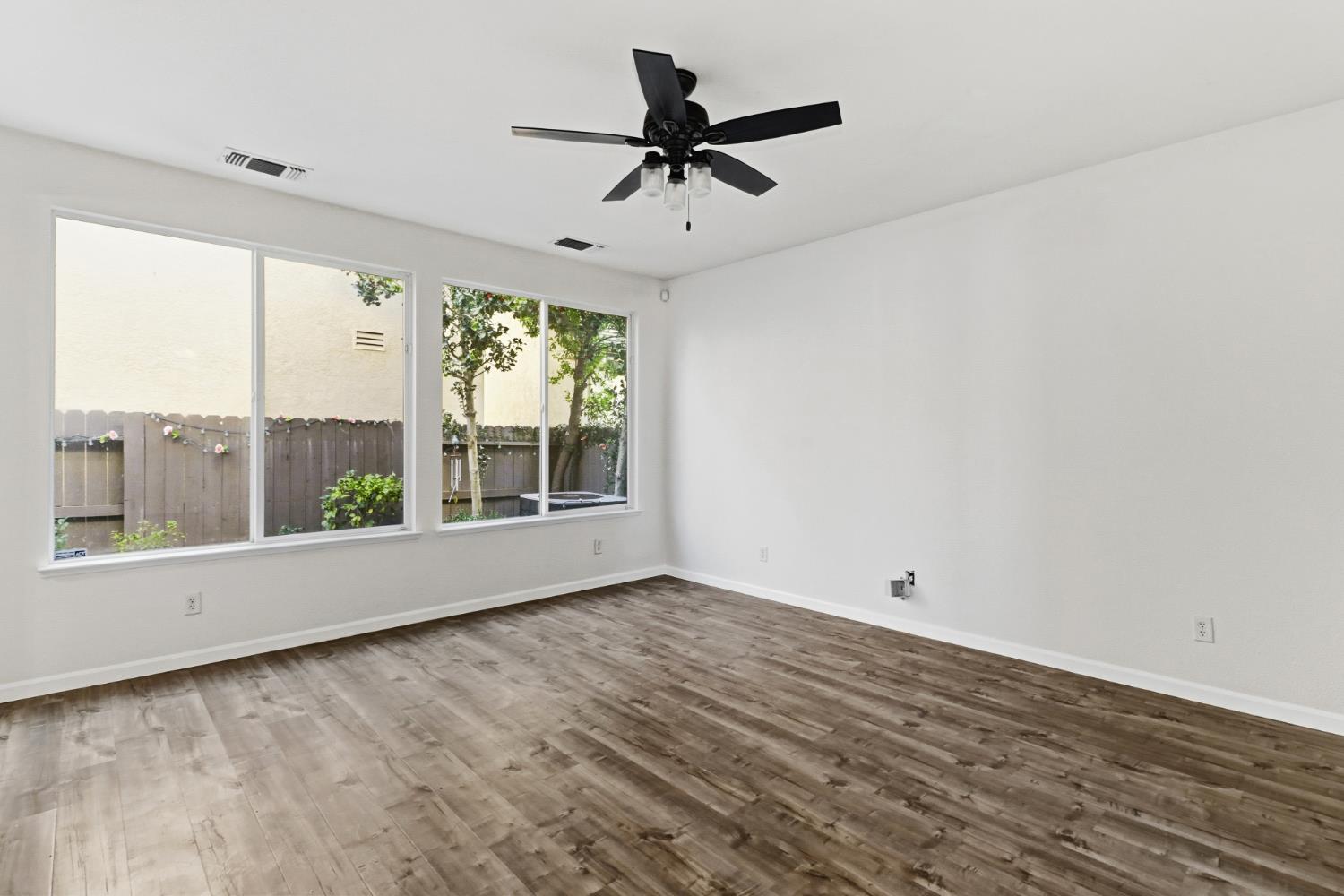 11832 Stoney Ridge Way Rancho Cordova, CA 95742 - Photo 2 of 44 wooden floor in an empty room with a window