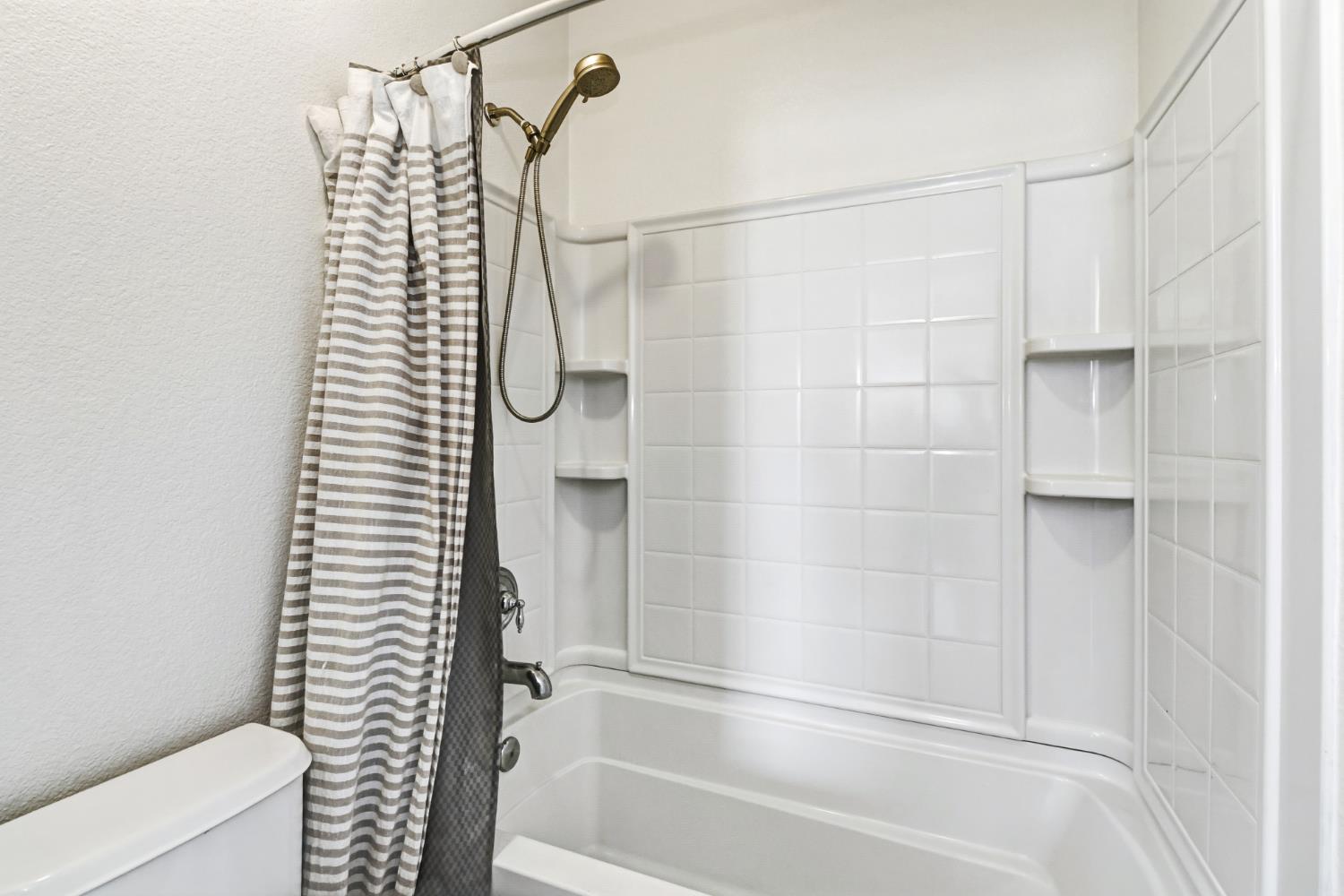 11832 Stoney Ridge Way Rancho Cordova, CA 95742 - Photo 34 of 44 a bathroom with a shower and a toilet