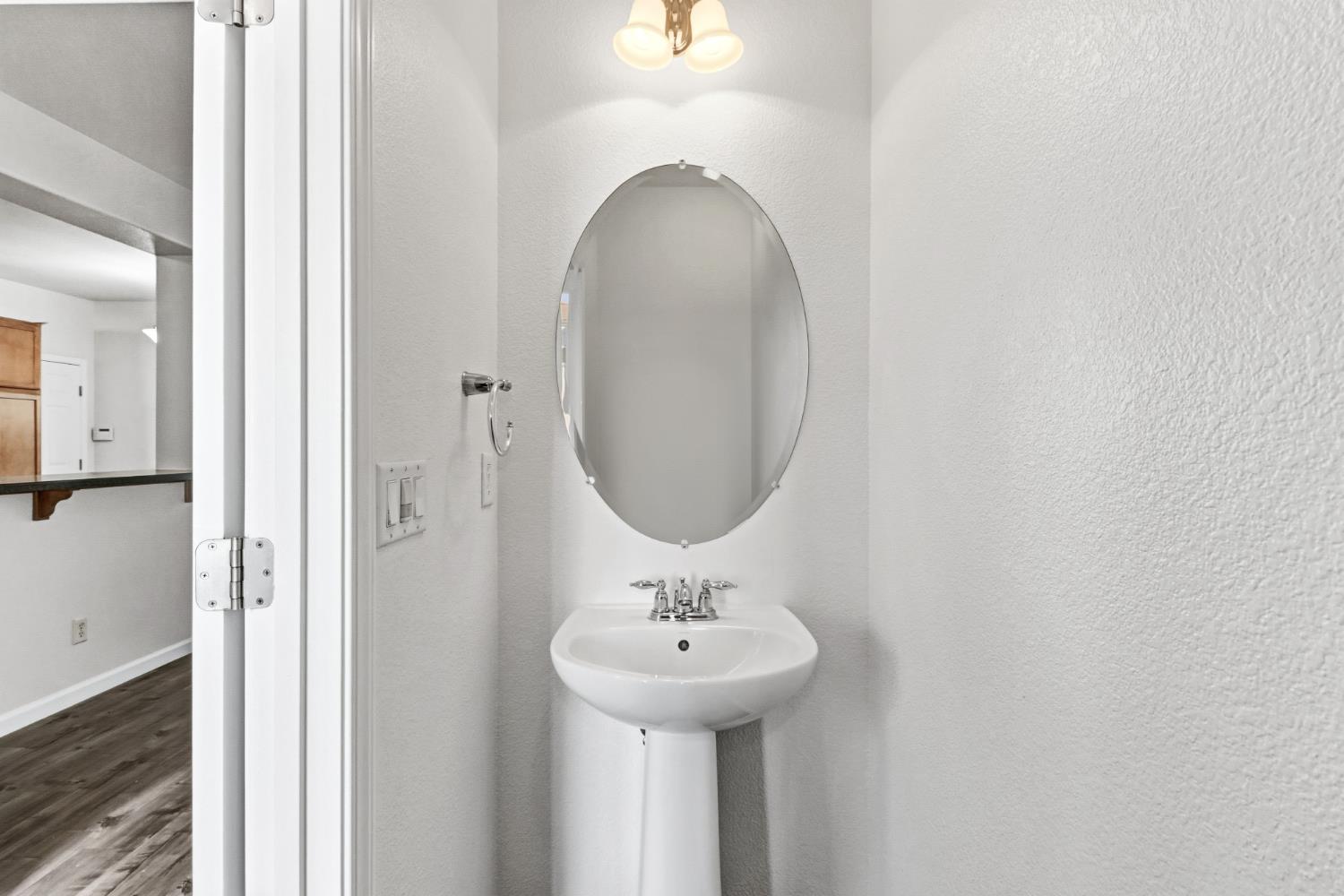 11832 Stoney Ridge Way Rancho Cordova, CA 95742 - Photo 37 of 44 a bathroom with a sink and a mirror