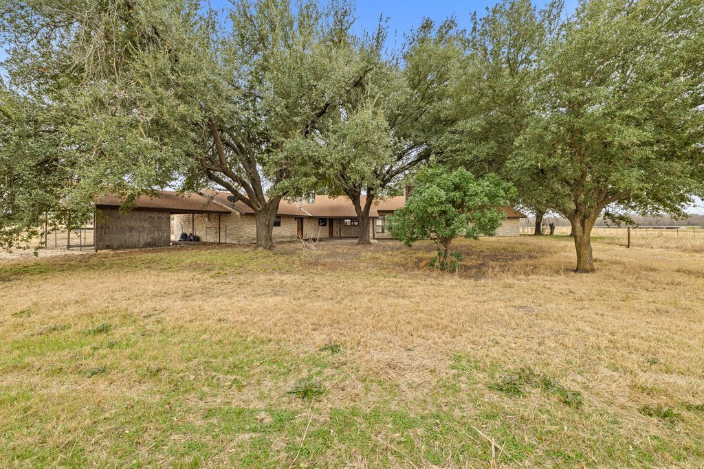 9562 Highway 53 Temple, TX 76501 - Photo 31 of 40 a view of a house with backyard and tree