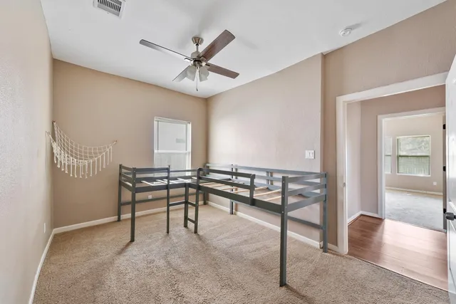 a view of a livingroom with furniture and a window