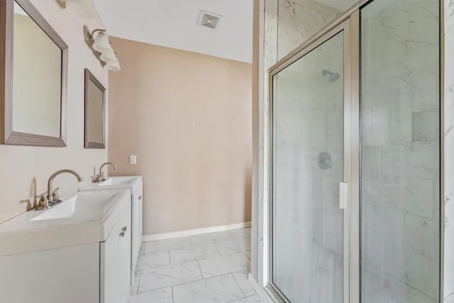 a bathroom with a sink and mirror