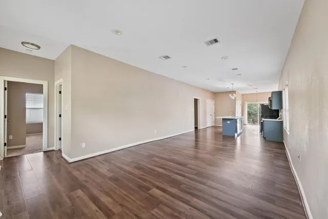 a view of a livingroom with wooden floor