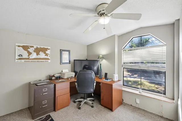 a workspace with furniture and window