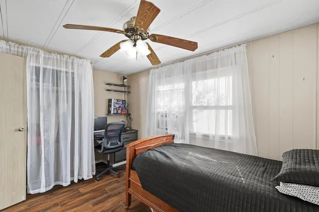 a bed room with a bed and a window