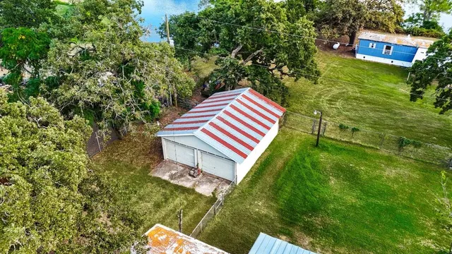 a backyard of a house with lots of green space
