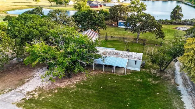 a view of a chair and table in the garden
