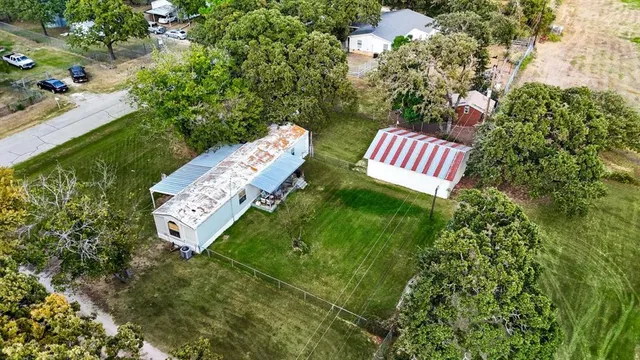 a view of a back yard of the garden and fire pit