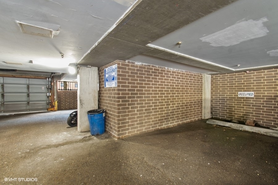 6102 North Sheridan Road, Unit 410 Chicago, IL 60660 - Photo 9 of 12 a view of empty room with garage