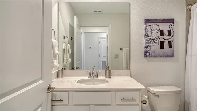 an aerial view of a house with a swimming pool patio and outdoor seating