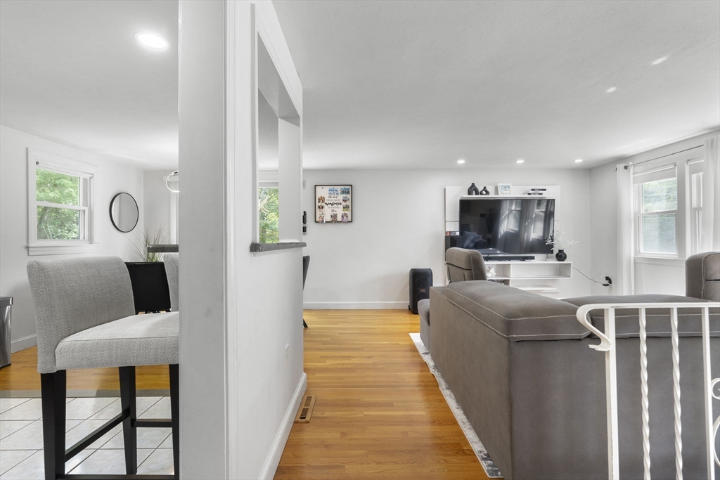 8 Governor Fuller Road Billerica, MA 01821 - Photo 10 of 33 a living room with furniture and a flat screen tv