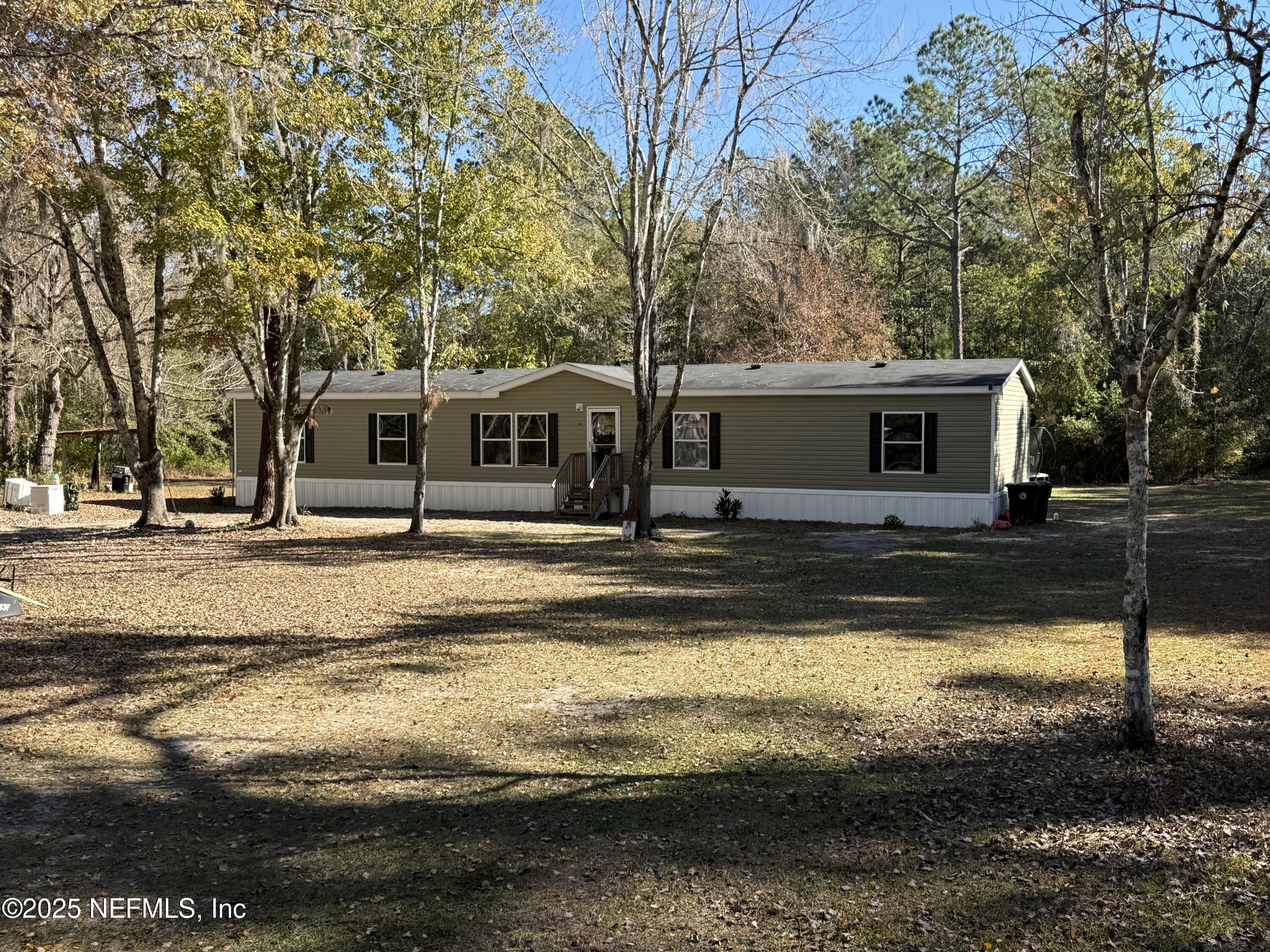 4527 Bondarenko Road Keystone Heights, FL 32656 - Photo 1 of 56 a view of a house with swimming pool
