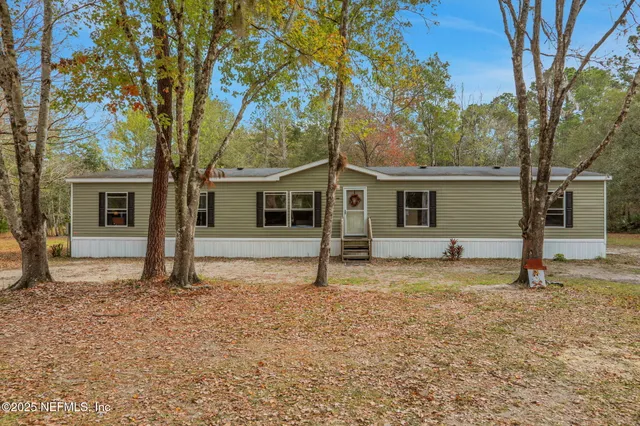 a view of a park with swings and slides