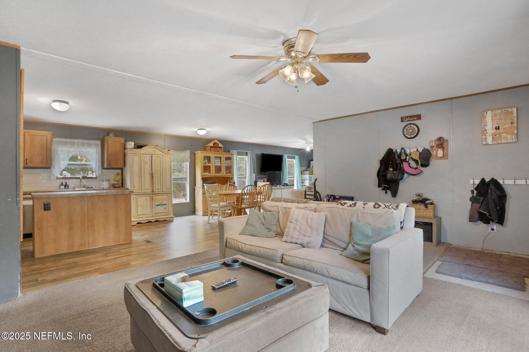 4527 Bondarenko Road Keystone Heights, FL 32656 - Photo 30 of 56 a living room with furniture and a view of kitchen