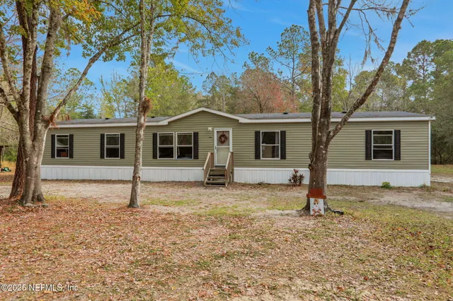 a house with trees in front of it