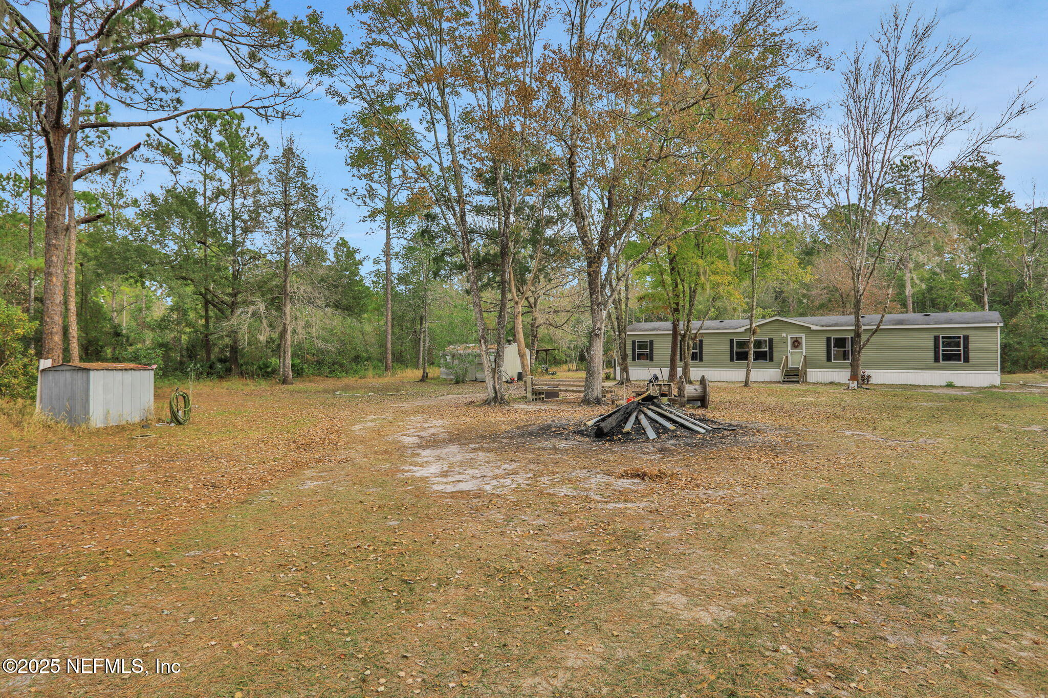 4527 Bondarenko Road Keystone Heights, FL 32656 - Photo 5 of 56 a view of a park with swings and slides