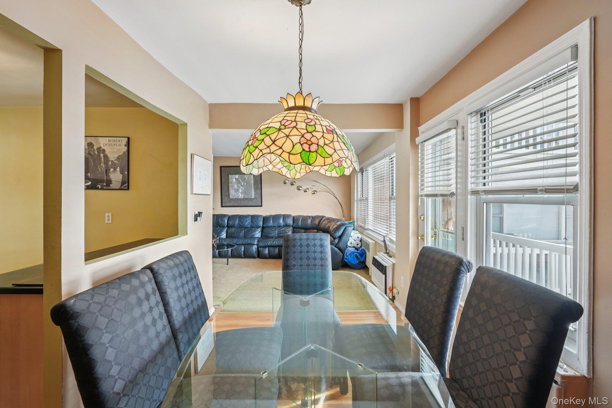 57 Maple Avenue, Unit 2B Hastings-on-Hudson, NY 10706 - Photo 11 of 38 a living room with furniture and a chandelier