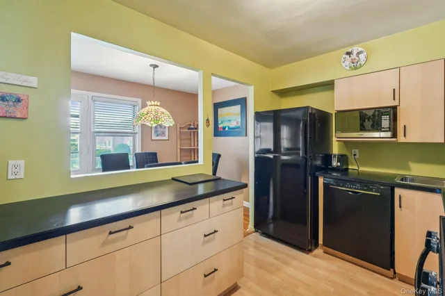a kitchen with a sink and refrigerator