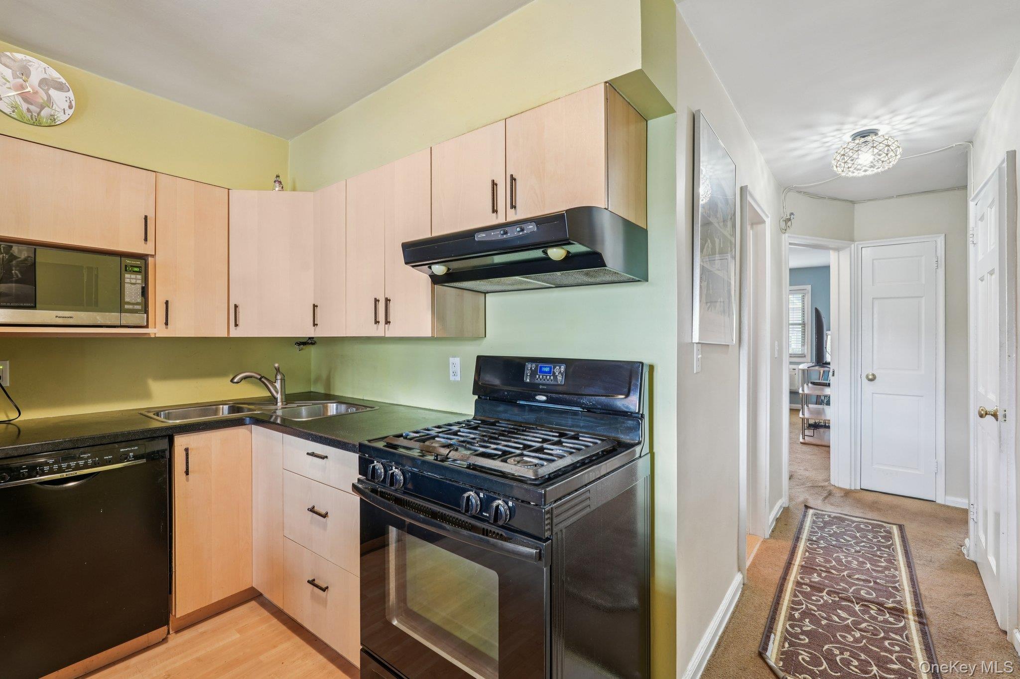 57 Maple Avenue, Unit 2B Hastings-on-Hudson, NY 10706 - Photo 14 of 38 a kitchen with granite countertop a stove and a sink