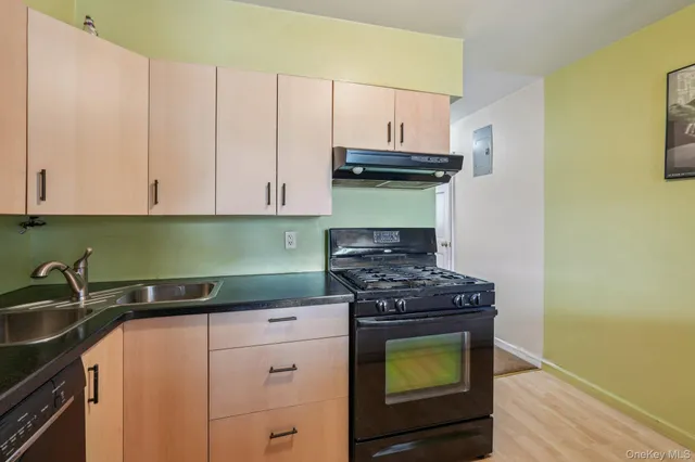 a kitchen with a stove and a cabinets