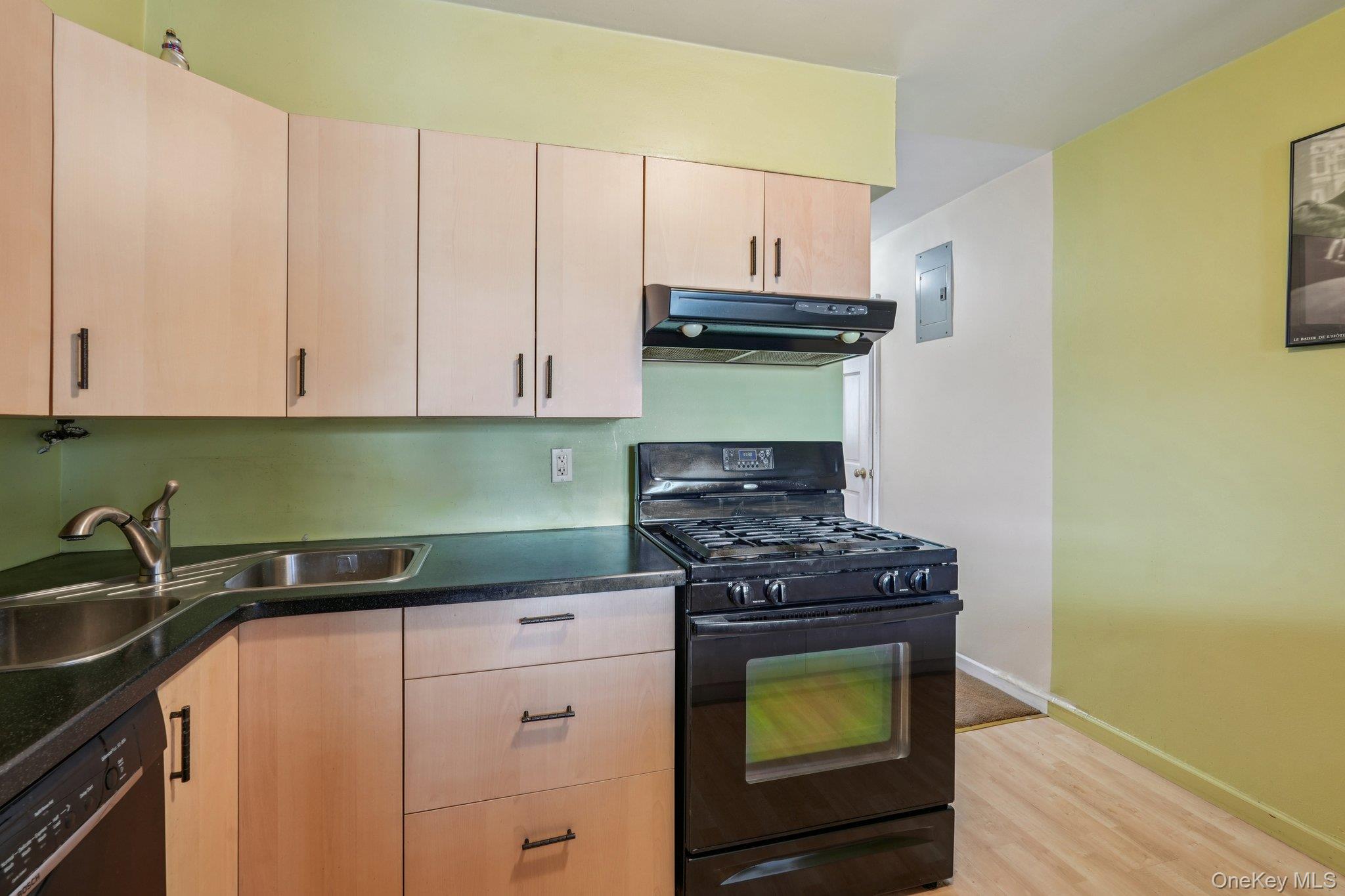 57 Maple Avenue, Unit 2B Hastings-on-Hudson, NY 10706 - Photo 15 of 38 a kitchen with a stove and a cabinets
