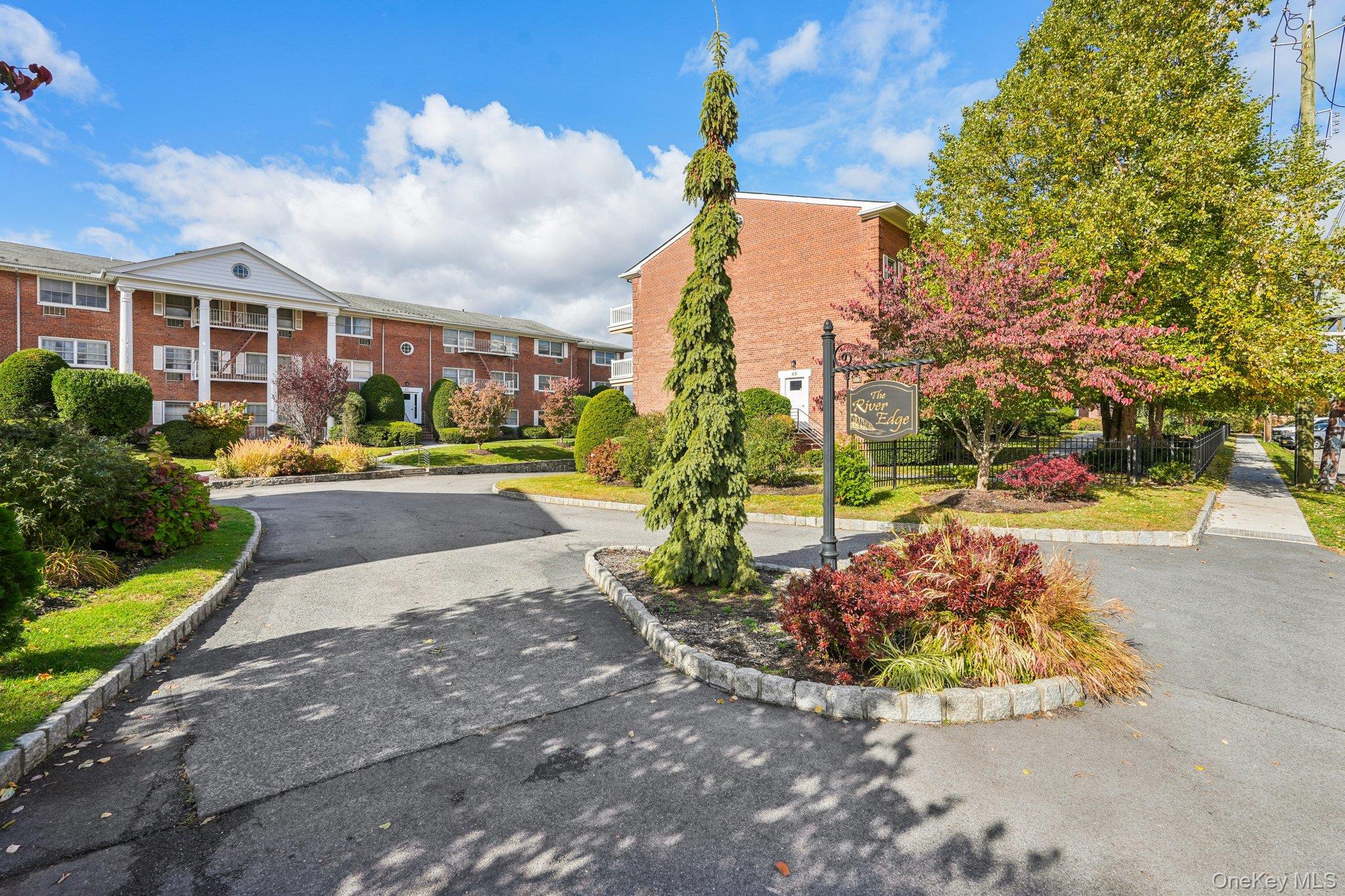57 Maple Avenue, Unit 2B Hastings-on-Hudson, NY 10706 - Photo 2 of 38 a view of a city with tall buildings