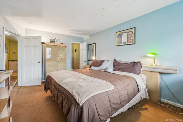 a bedroom with a bed and a table