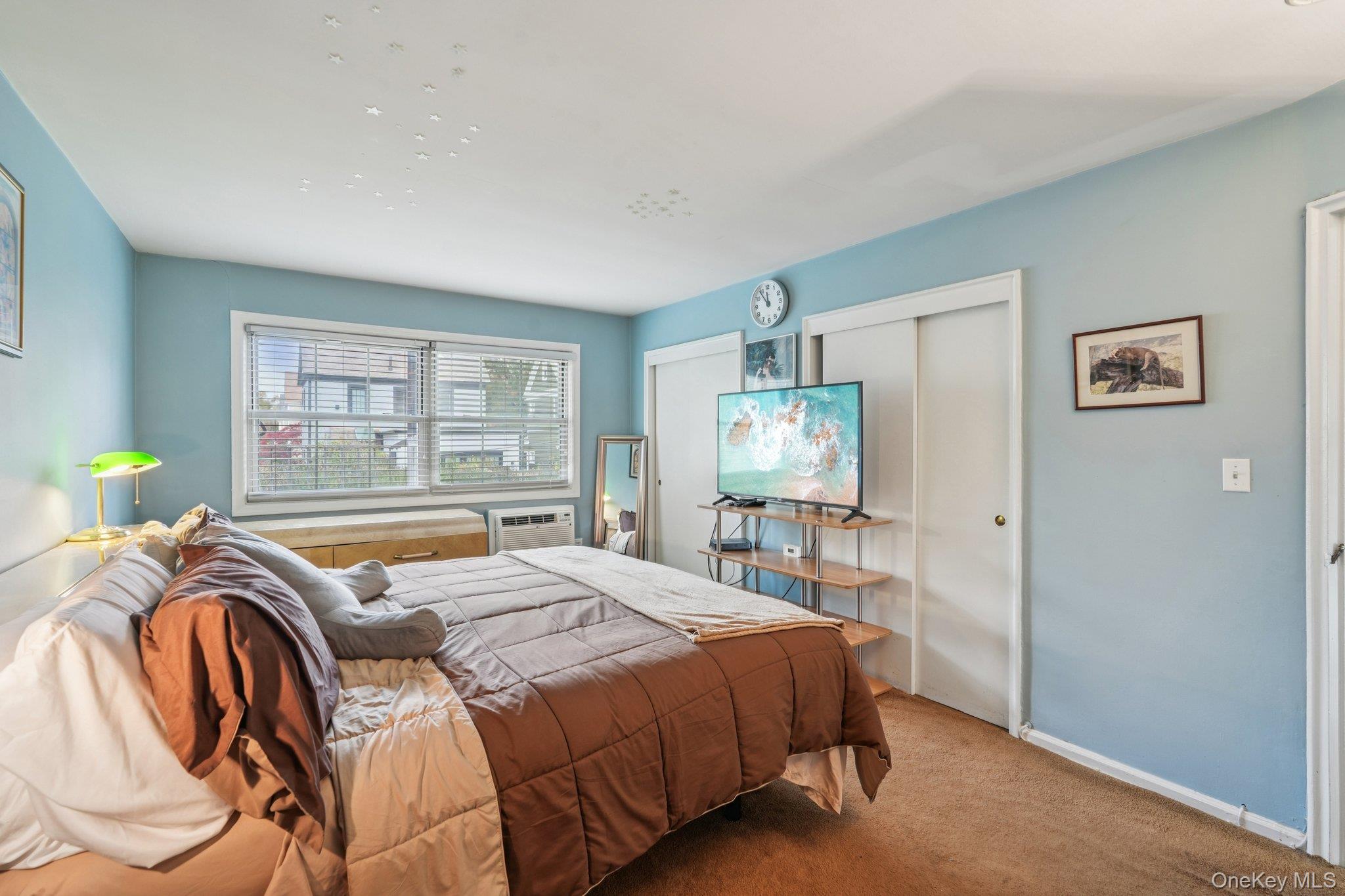 57 Maple Avenue, Unit 2B Hastings-on-Hudson, NY 10706 - Photo 22 of 38 a bedroom with a bed and a window