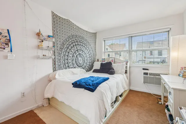 a bedroom with a bed and a table with chair