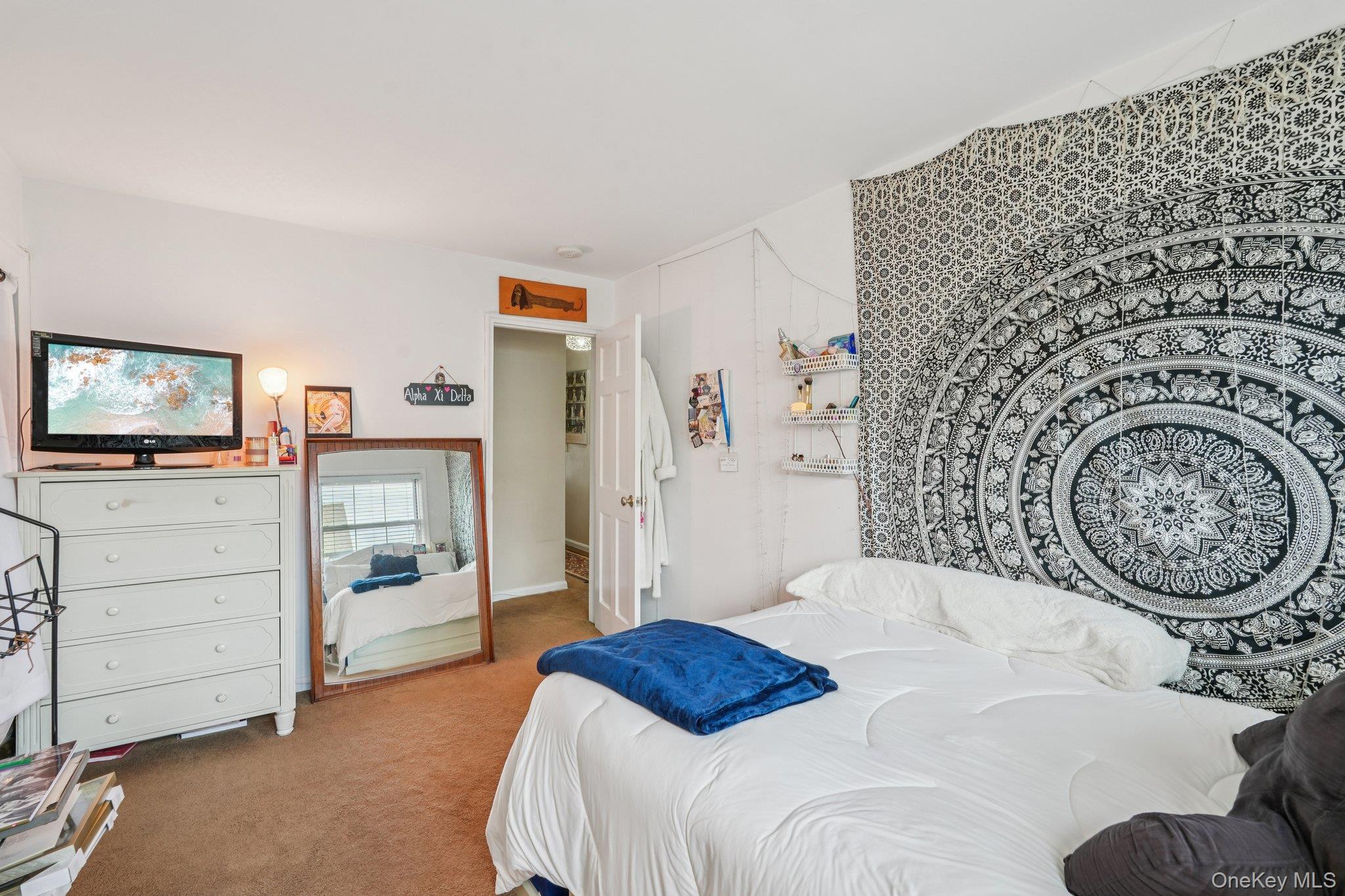 57 Maple Avenue, Unit 2B Hastings-on-Hudson, NY 10706 - Photo 26 of 38 a bedroom with a bed and a television