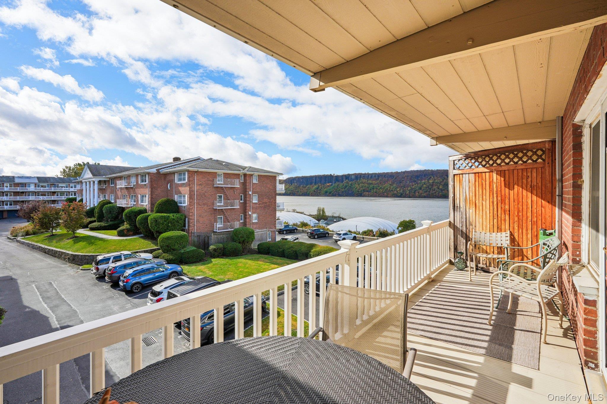 57 Maple Avenue, Unit 2B Hastings-on-Hudson, NY 10706 - Photo 30 of 38 a view of a balcony with two chairs and a table