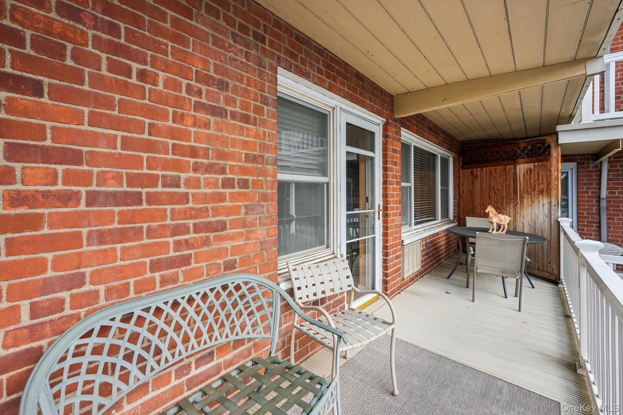 57 Maple Avenue, Unit 2B Hastings-on-Hudson, NY 10706 - Photo 31 of 38 a view of a patio with a table and chairs