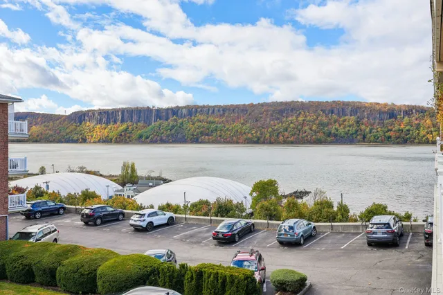 a view of lake with lawn chairs