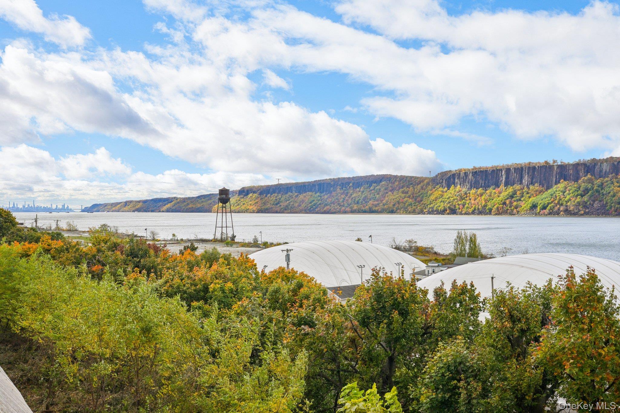 57 Maple Avenue, Unit 2B Hastings-on-Hudson, NY 10706 - Photo 33 of 38 a view of a lake with houses in the back