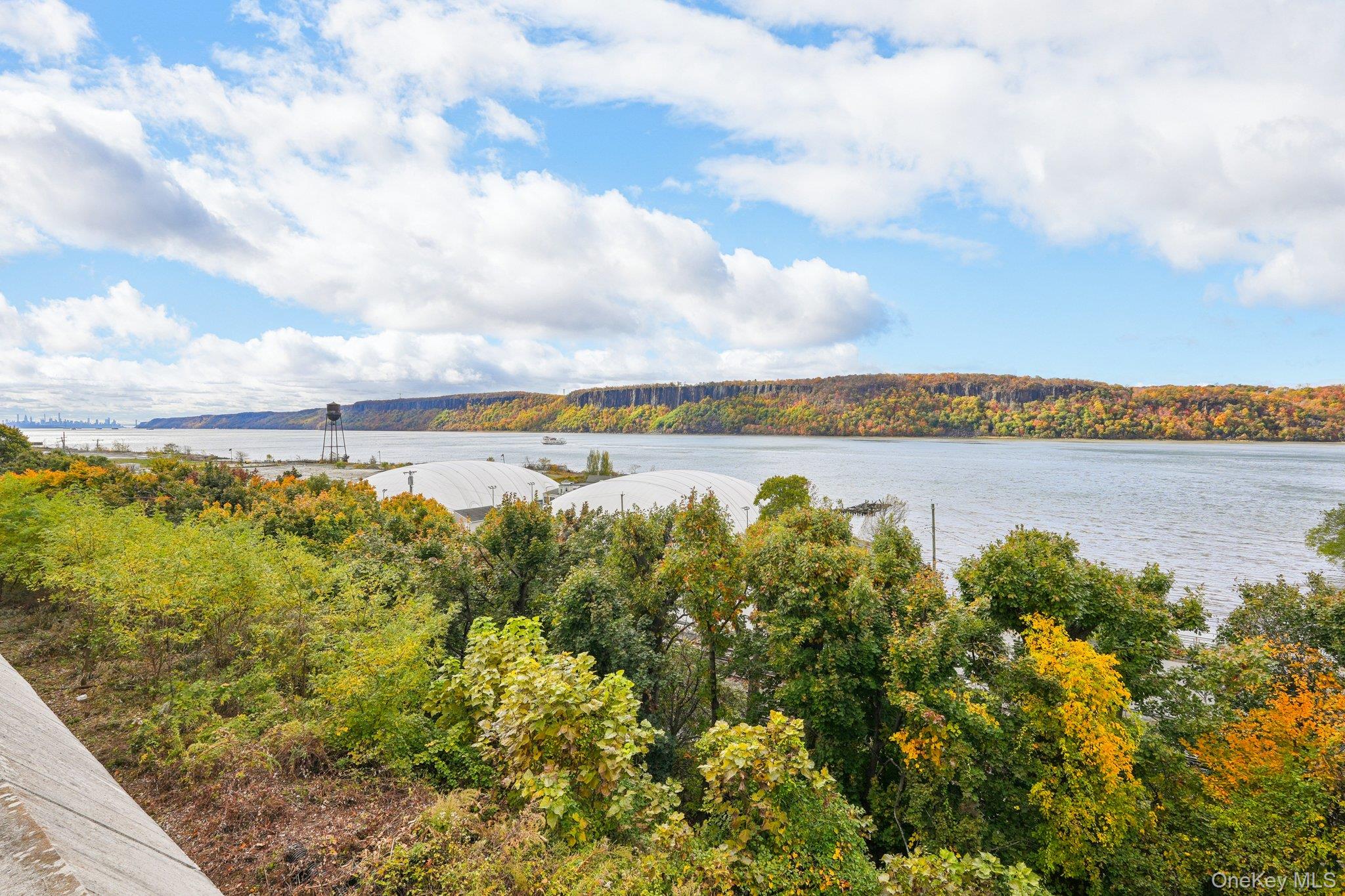 57 Maple Avenue, Unit 2B Hastings-on-Hudson, NY 10706 - Photo 34 of 38 a view of a lake with houses in the back