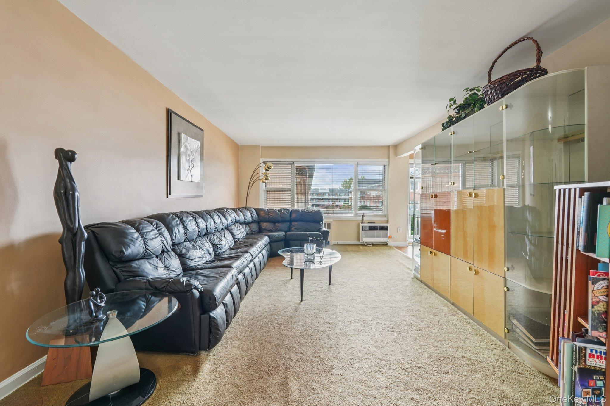 57 Maple Avenue, Unit 2B Hastings-on-Hudson, NY 10706 - Photo 6 of 38 a living room with furniture and a wooden floor