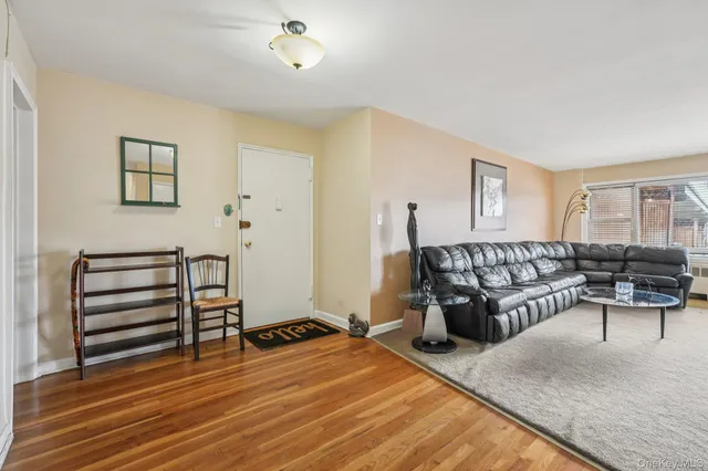 a bedroom with furniture and wooden floor