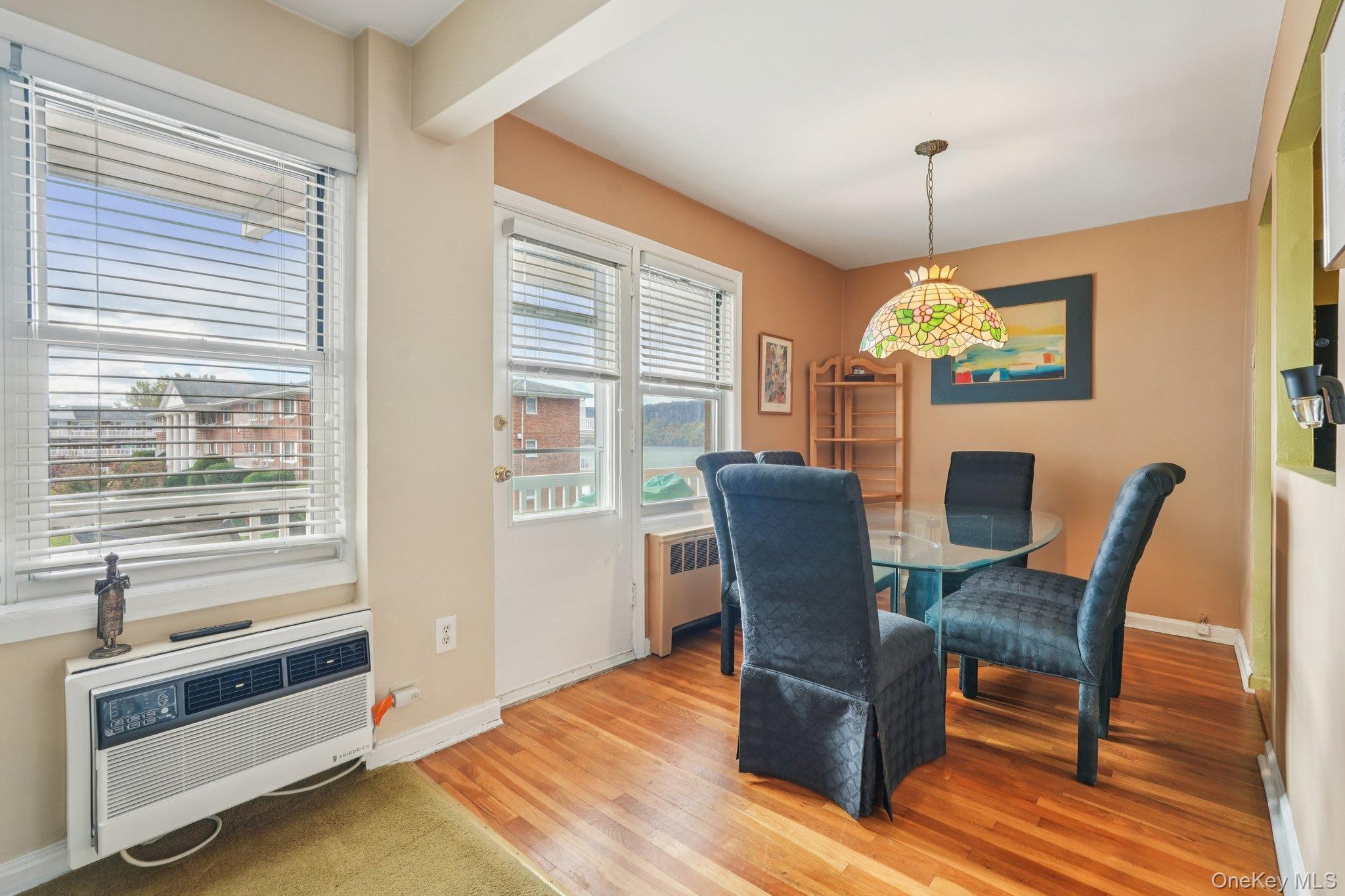 57 Maple Avenue, Unit 2B Hastings-on-Hudson, NY 10706 - Photo 10 of 38 a view of a dining room with furniture window and wooden floor