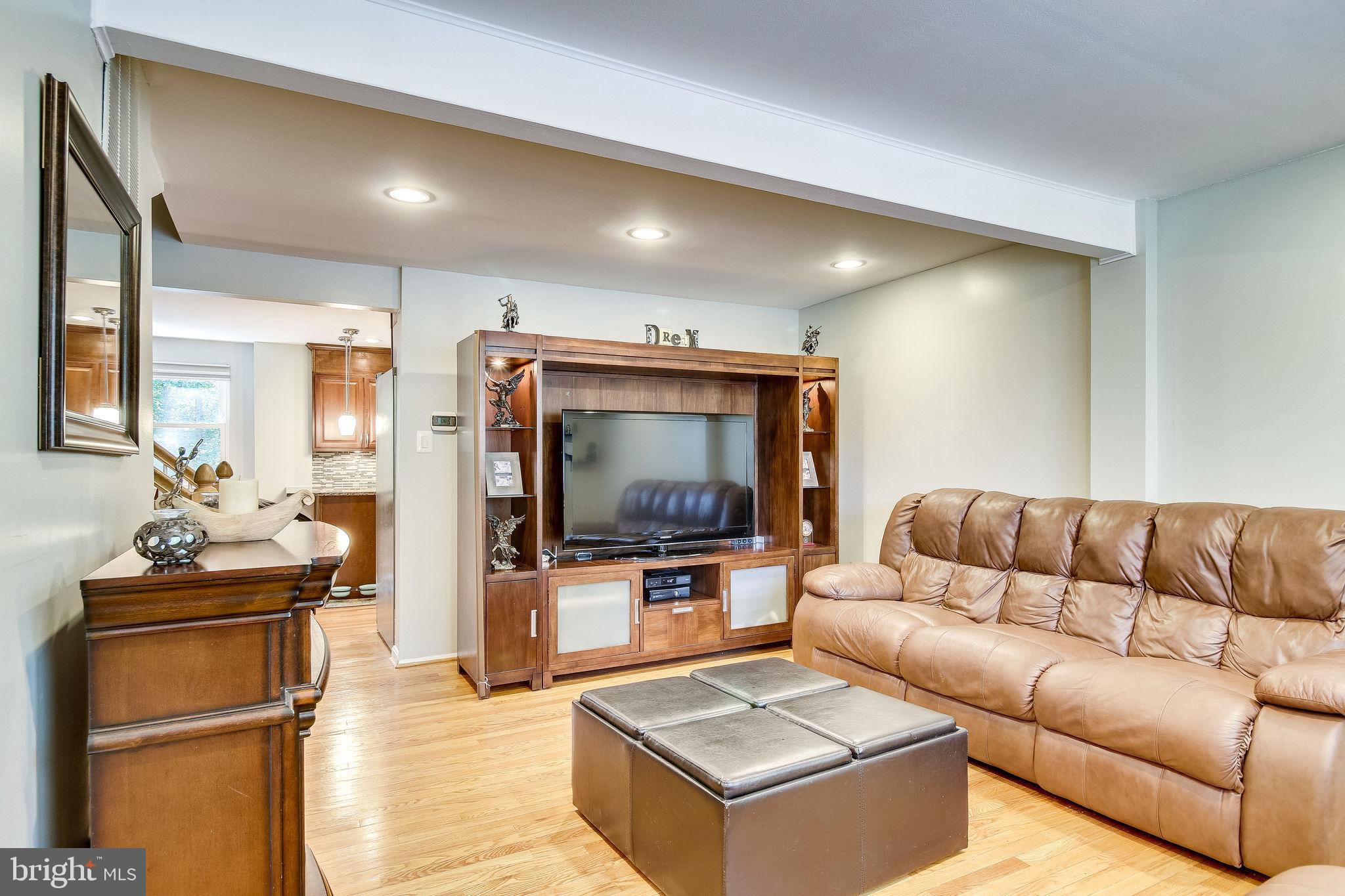 8180 Dark Den Circle Springfield, VA 22153 - Photo 5 of 30 Glimmering hardwoods with newer lighting