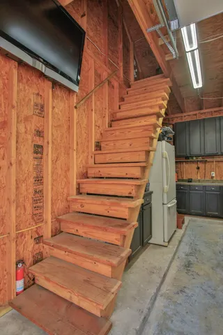 a view of a backyard with seating area